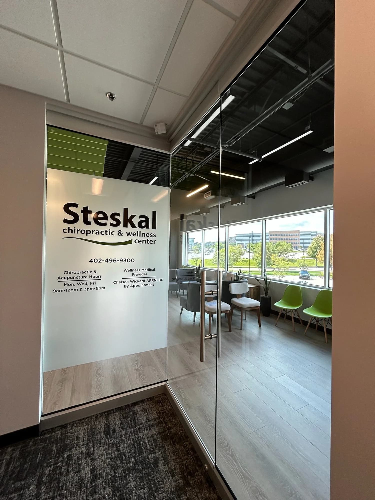 Steskal Chiropractic & Wellness Center entrance and waiting room in Omaha, painted by DGR