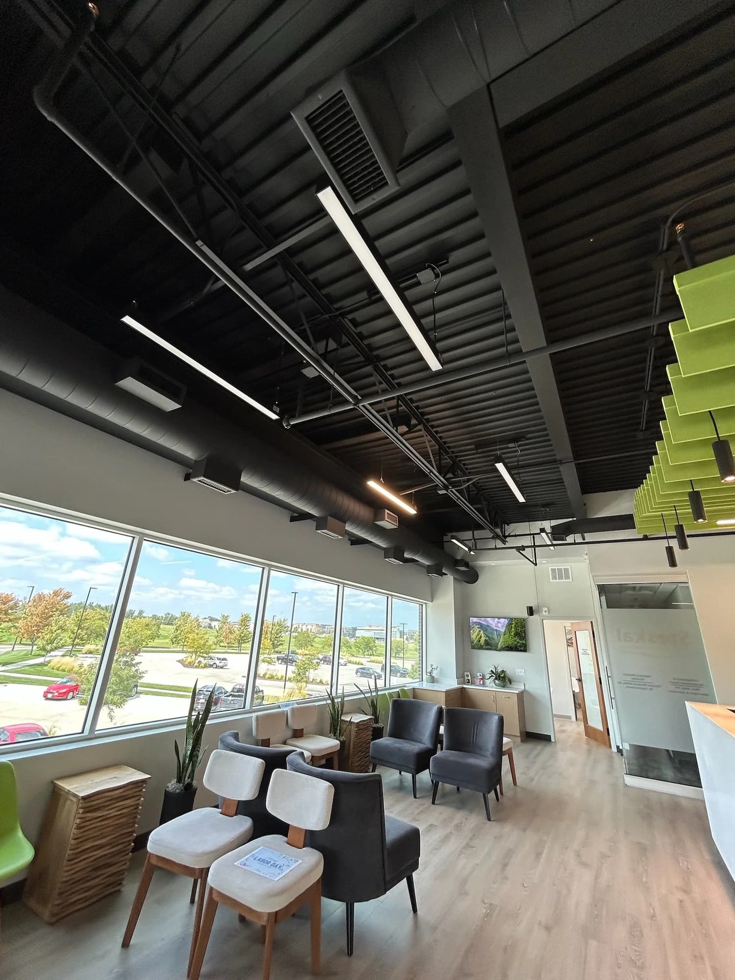 Painted ceilings and acoustic baffles at Steskal Chiropractic in Omaha
